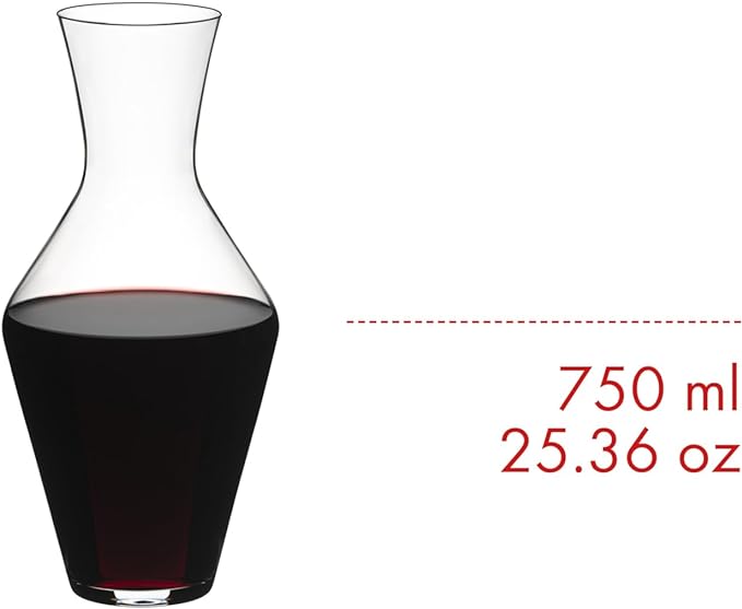 Riedel veloce decanter with red wine inside with volume on a white background