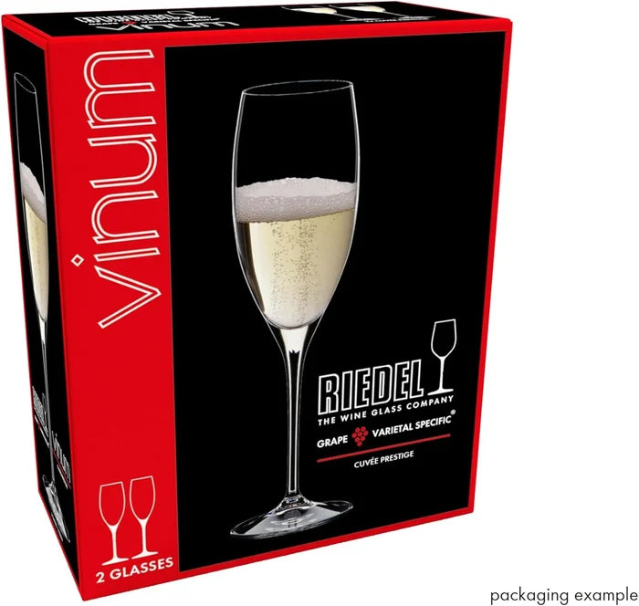 Riedel wine glass packaging with a glass of champagne on a black background