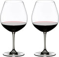 Two clear stemmed wine glasses filled with red wine, shown side by side on a plain white background.