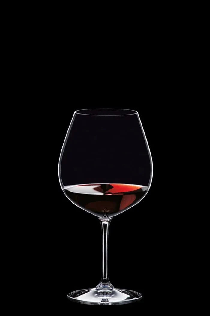 Wine glass with red wine on a black background