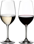 Two elegant wine glasses on a white background, one filled with white wine and the other with red wine.