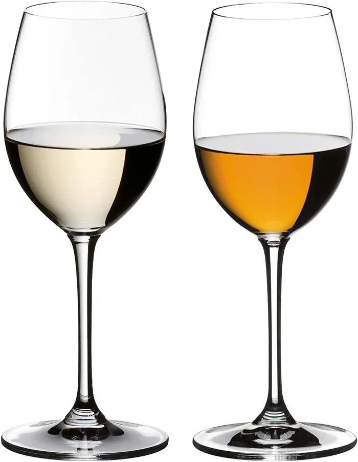 Two wine glasses filled with white and red wine on a white background