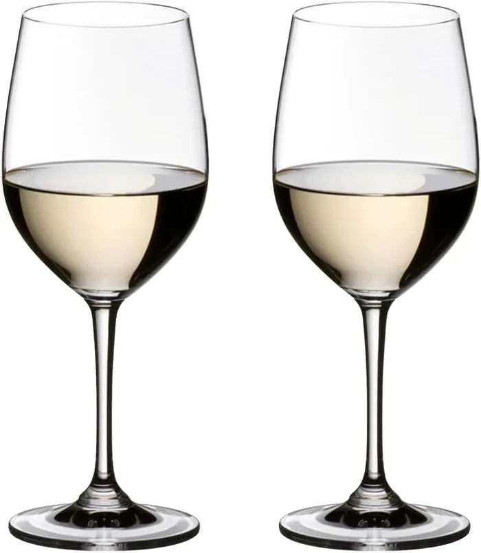 Two clear stemmed wine glasses filled with white wine, shown side by side on a plain white background.
