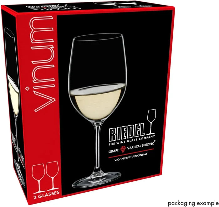 Boxed wine glass set shown at an angle, featuring a large black front panel with a clear stemmed wine glass filled with white wine and red side panels. Visible text includes 'vinum', 'RIEDEL THE WINE GLASE COMPANY', and 'GRAPE VARIETAL SPECIFIC'.