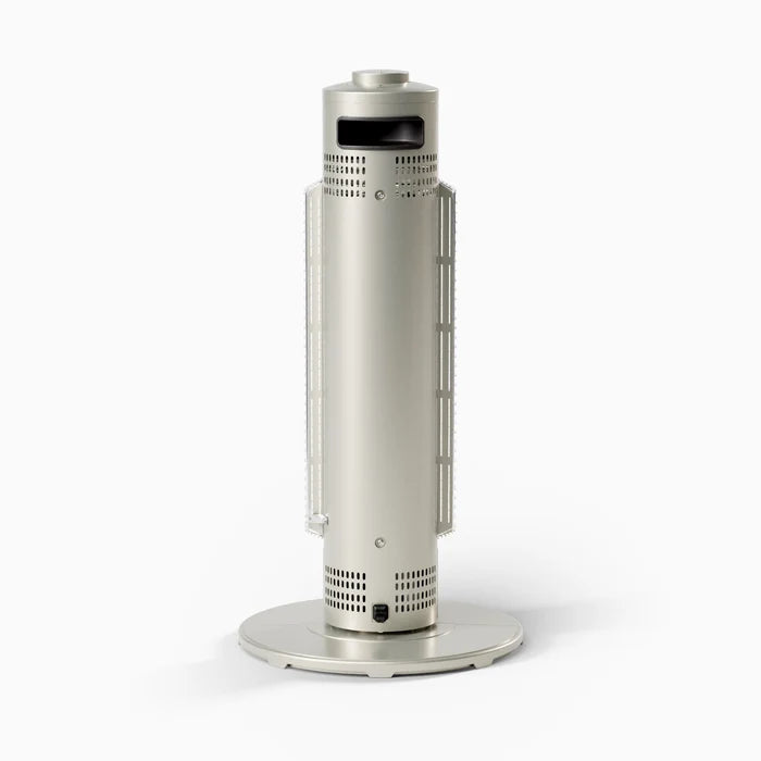 A sleek, modern cylindrical electric heater in a metallic silver finish, standing upright on a circular base against a clean white background.