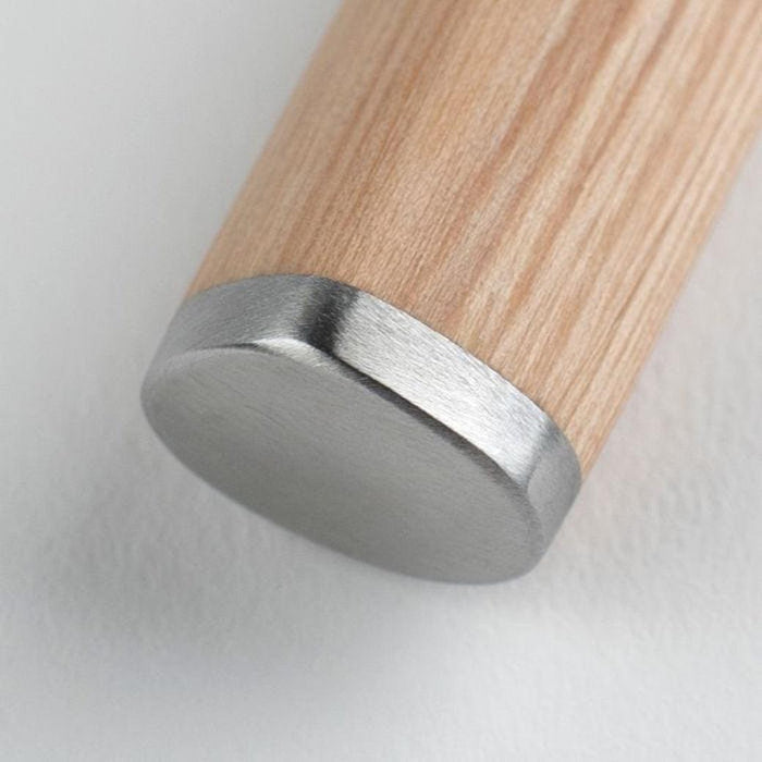 Close up of the bottom of the handle of Shun Classic Blonde Chef's Knife 6″ displayed on a white background