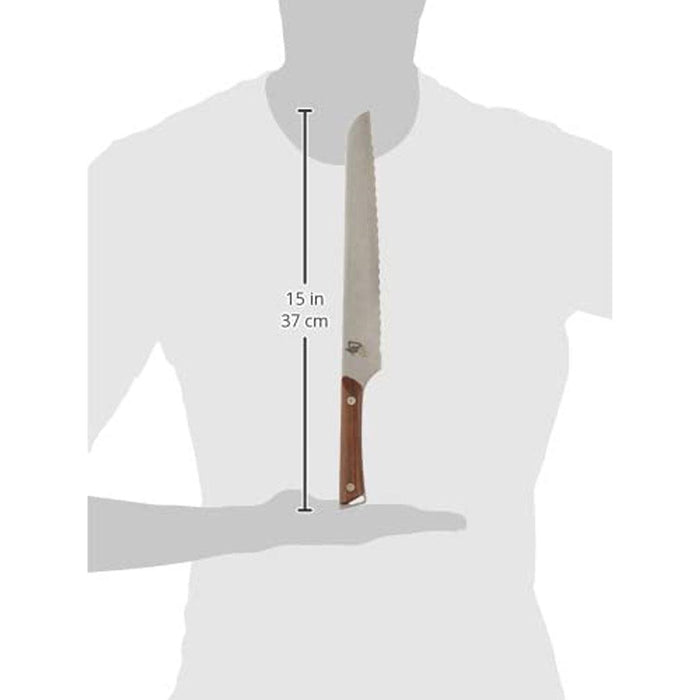 Shun Kanso Bread Knife - 9″ displayed vertically with a a gray figure in the background with dimensions displayed