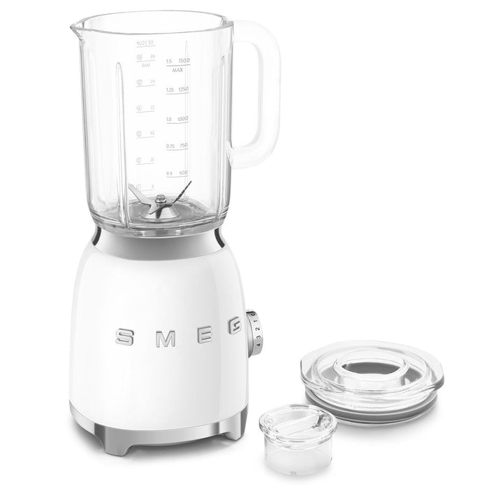White Smeg 50s retro line blender with clear jar and attachments on a white background