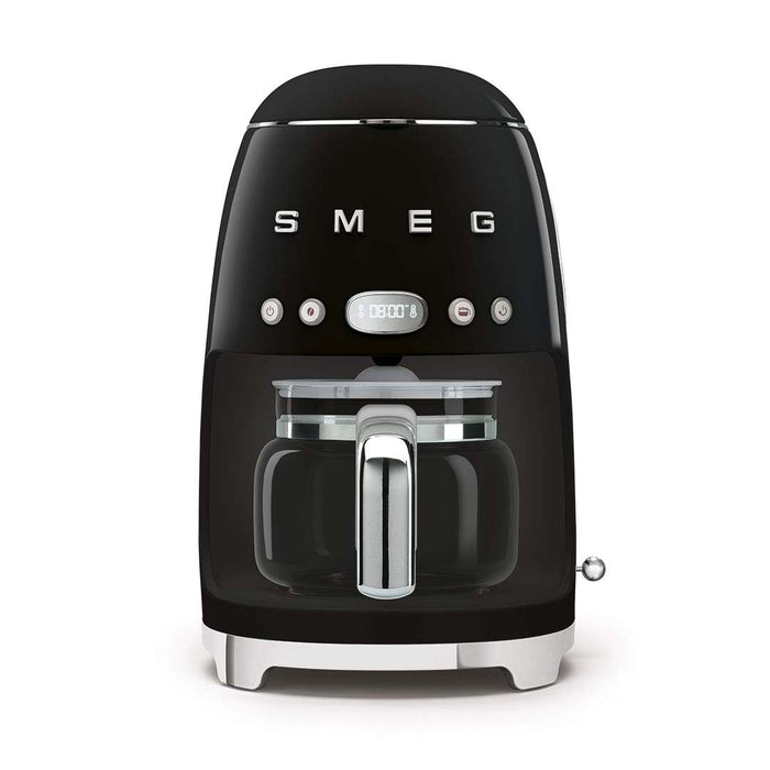 Front view of black Smeg coffee machine on a white background