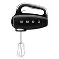 Front view of black Smeg 50s retro line hand mixer with whisk attachments displayed on a white background