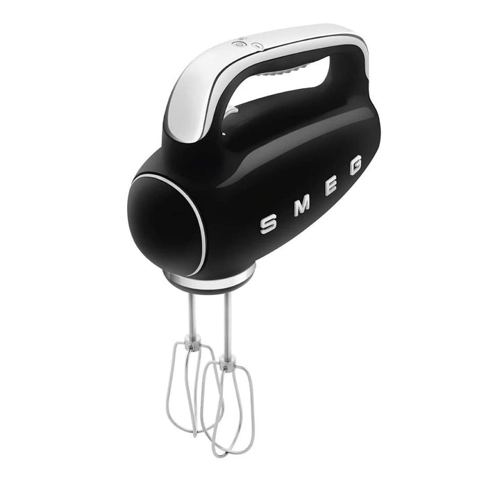 Black Smeg 50s retro line hand mixer with whisk attachments displayed on a white background