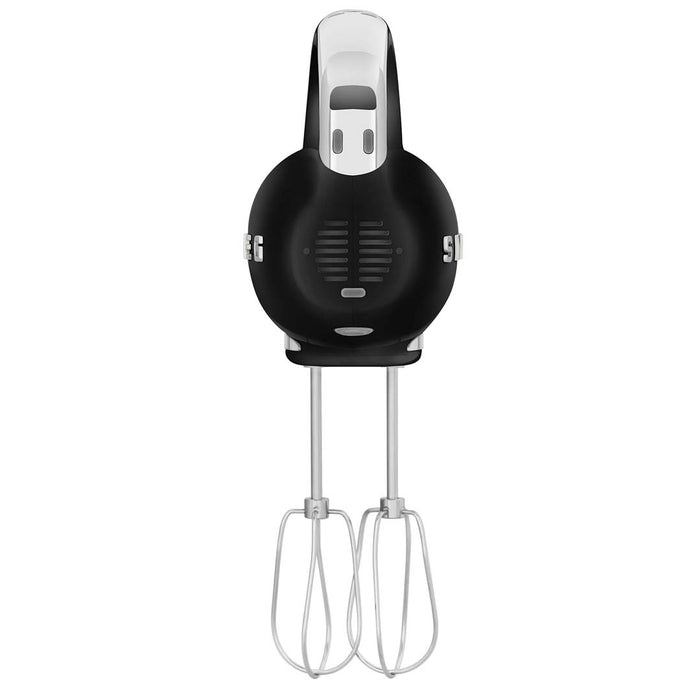 Back view of black Smeg 50s retro line hand mixer with whisk attachments displayed on a white background