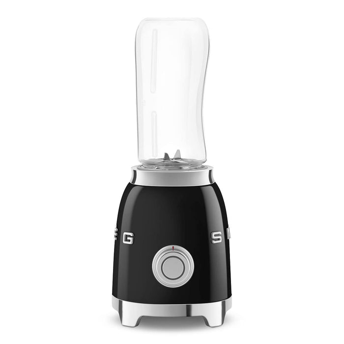 Side view of black Smeg retro line personal blender on a white background