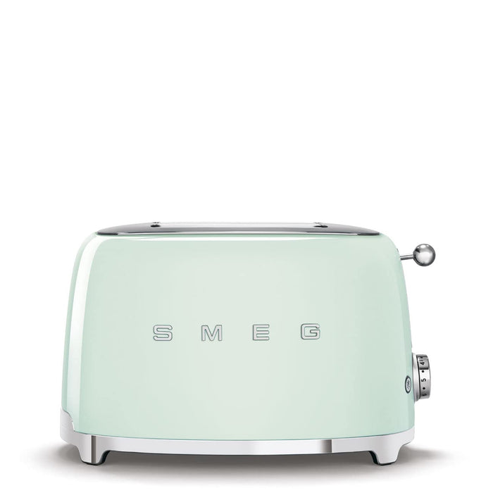 Front view of mint green toaster with 'SMEG' branding on a white background