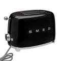Black 2 slice Smeg 50s retro style electric toaster displayed on a white background