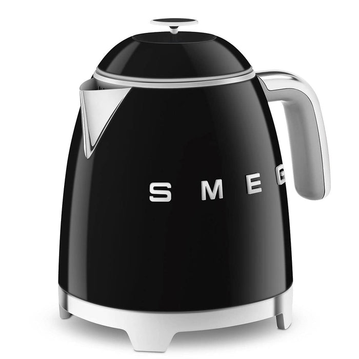 Black Smeg 50s retro style electric mini kettle displayed on a white background