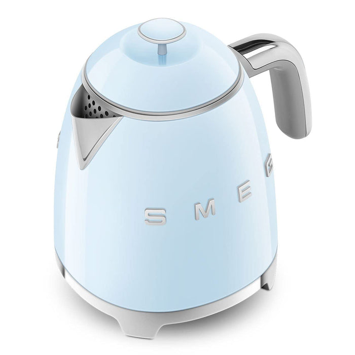 Light blue Smeg kettle with silver accents on a white background