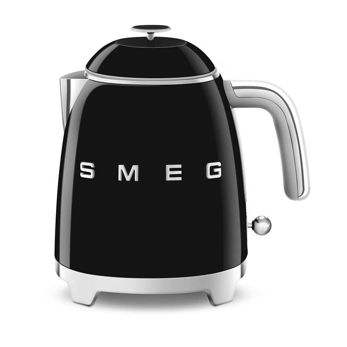 Front view of black 1.7 liter Smeg 50s retro style electric mini kettle displayed on a white background