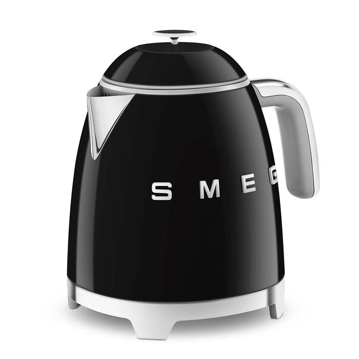 Black 1.7 liter Smeg 50s retro style electric mini kettle displayed on a white background