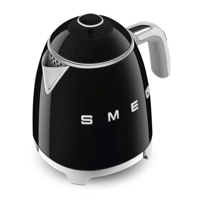 Black 1.7 liter Smeg 50s retro style electric mini kettle displayed on a white background