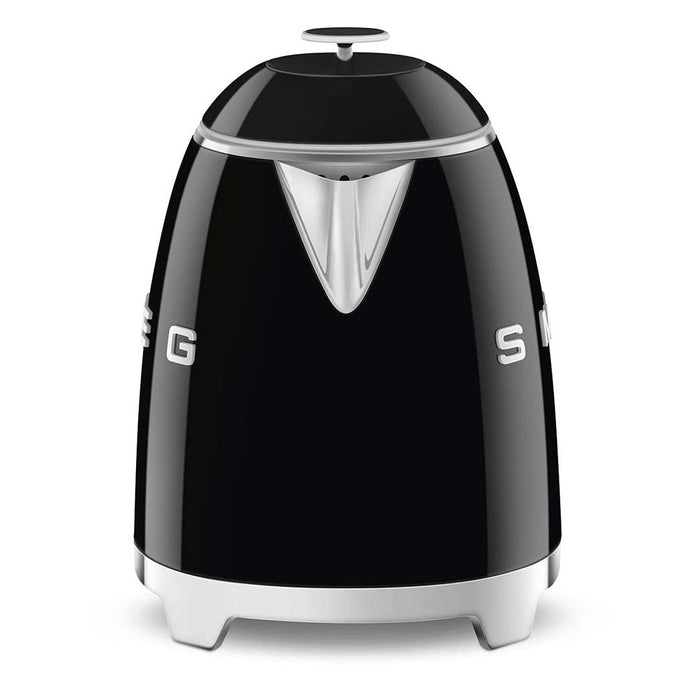 Side view of black 1.7 liter Smeg 50s retro style electric mini kettle displayed on a white background