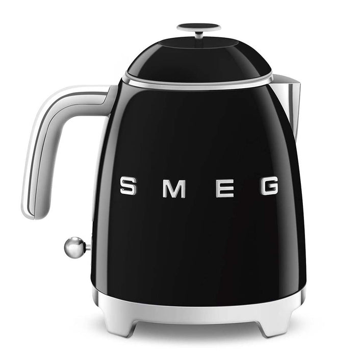 Front view of black 1.7 liter Smeg 50s retro style electric mini kettle displayed on a white background