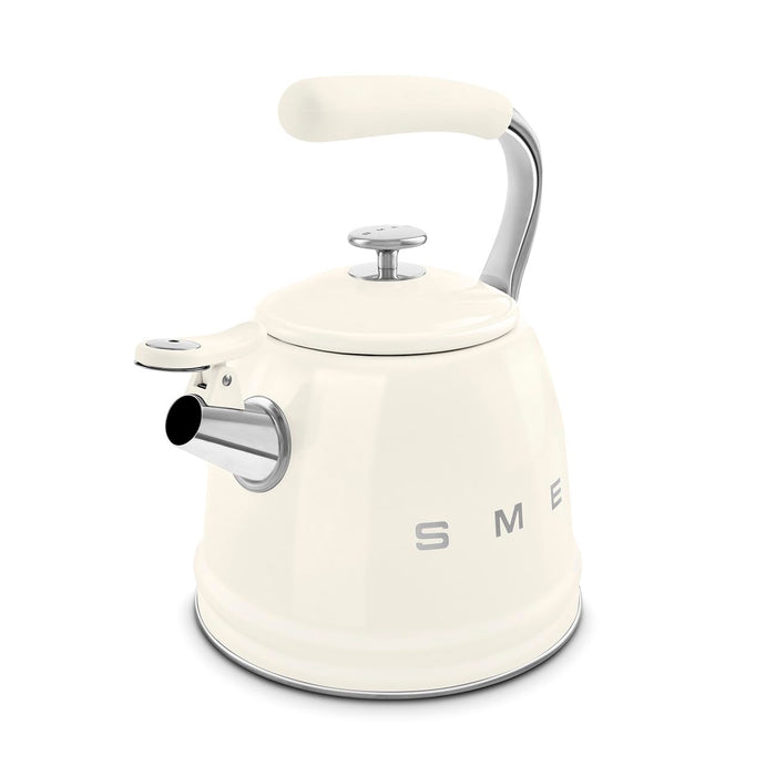 Cream-colored stovetop kettle with silver features on a white background