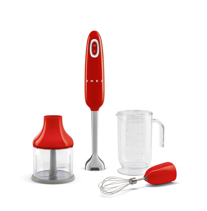 Red Smeg hand blender with attachments on a white background