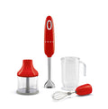 Red Smeg hand blender with attachments on a white background