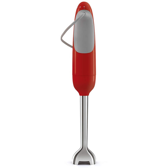 Back view of red Smeg hand blender with attachments displayed on a white background