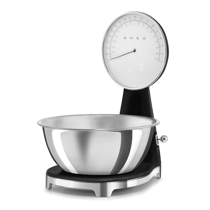 Black, silver Smeg retro style analog digital kitchen scale on a white background