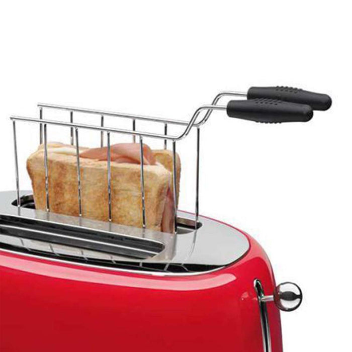 Close up of Smeg sandwich rack with a sandwich inside with a red toaster displayed on a white background