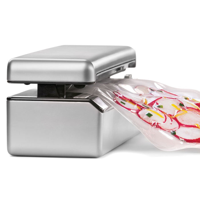 SousVide Supreme Sous Vide SousVide Supreme Vacuum Sealer VS3000 w/ 12 Cooking Pouches sealing a pouch full of food displayed on a white background