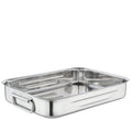 Stainless steel roasting pan on a white background