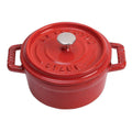 Staub Cast Iron 0.25-qt Mini Round Cocotte in cherry displayed on a white background