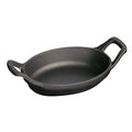 Matte black Staub Cast Iron 5.5″ x 3.8″ Mini Oval Gratin Baking Dish displayed on a white background