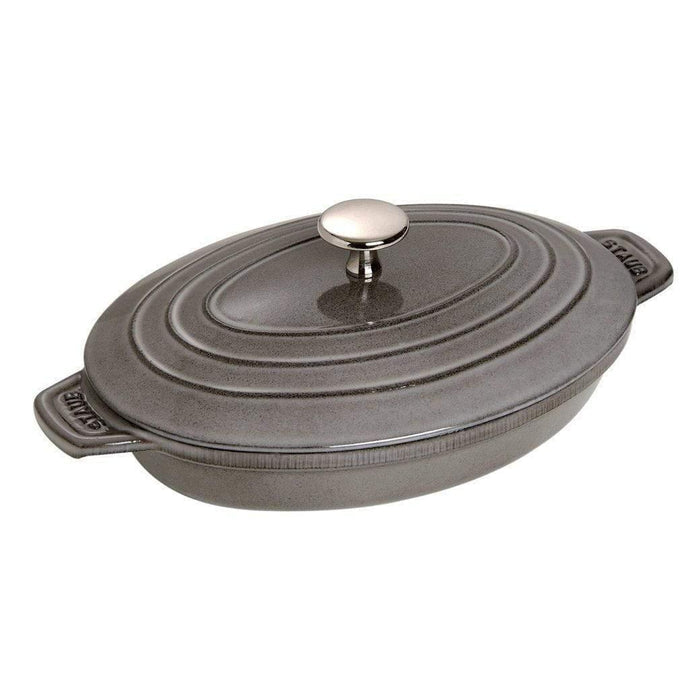 Graphite grey Staub Cast Iron 9″ x 6.6″ Oval Covered Baking Dish displayed on a white background