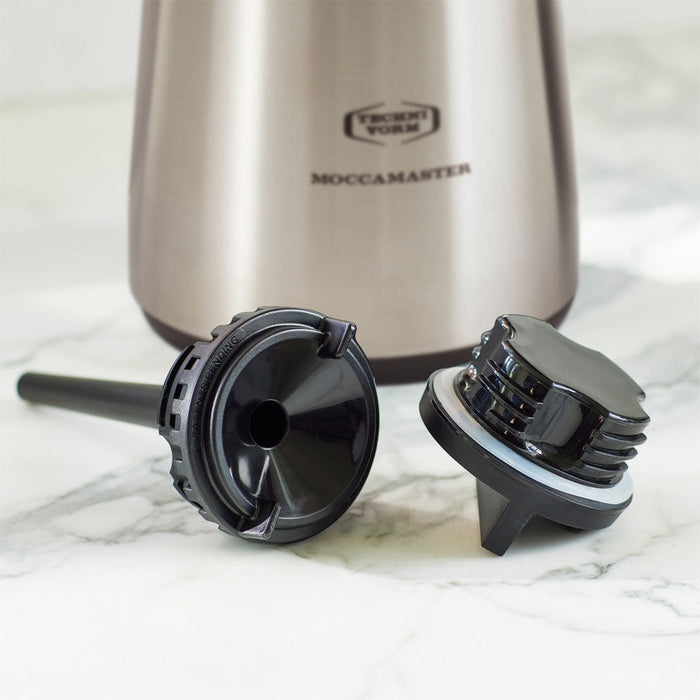 2 black parts of a technivorm thermal carafe on a marble surface