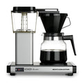 Front view of matte silver Technivorm Moccamaster K 741 Coffee Brewer with coffee filled carafe displayed on a white background