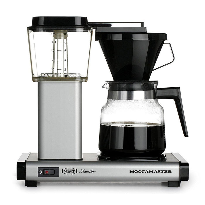 Front view of matte silver Technivorm Moccamaster K 741 Coffee Brewer with coffee filled carafe displayed on a white background