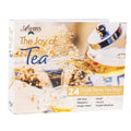 Box of Ashbys 'The Joy of Tea' with tea being poured into a glass on a white background