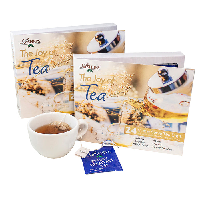 Two boxes of Ashby's 'The Joy of Tea' with a cup of tea and a tea bag on a white background