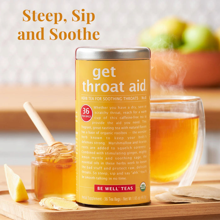 The Republic of Tea get throat aid tea tin with honey and tea in the background