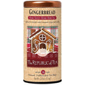 Tea canister with gingerbread house design and 'The Republic of Tea' branding on a white background