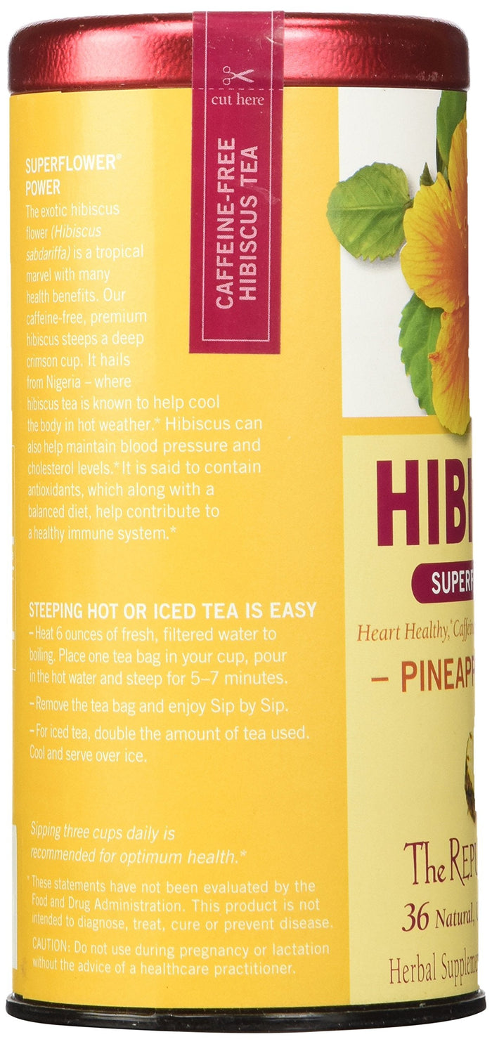 Yellow canister of hibiscus tea with red lid on a white background
