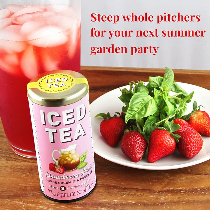 Iced tea can with strawberries on a plate next to a Strawberry Basil tea canister displayed on a wooden table