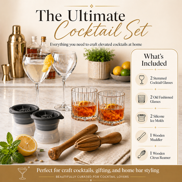 Cocktail set with glasses, ice molds, and tools on a kitchen counter.