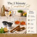Cocktail set with glasses, ice molds, and tools on a kitchen counter.