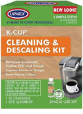 Urnex K-Cup cleaning and descaling kit packaging with coffee machine and cup on a wooden background