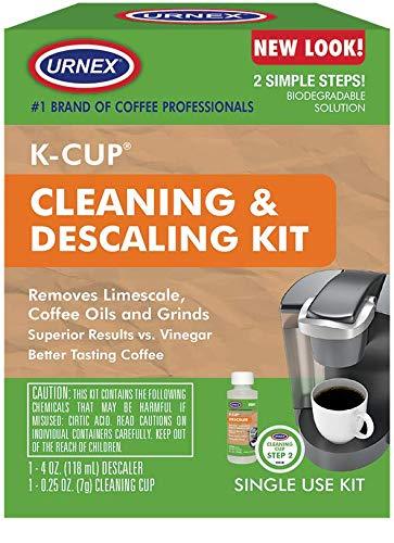 Urnex K-Cup cleaning and descaling kit packaging with coffee machine and cup on a wooden background